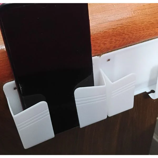 Soporte para Celular de Plástico con Adhesivo para Pared